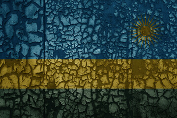 flag of rwanda on a old grunge metal rusty cracked wall background