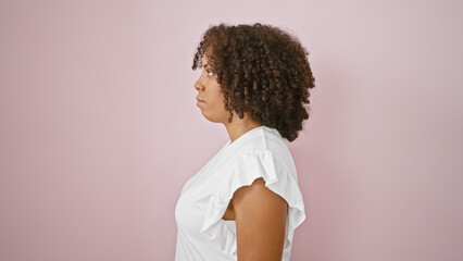 African american woman with natural hair against pink background