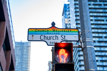 A street sign for Church Street with the rainbow color scheme indicating a street in the Church...