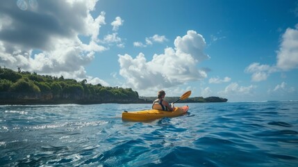 A person in a kayak energetically paddling through the water on a sunny day.