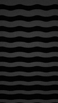 Abstract geometric zig zag grey lines pattern on black background. Trendy moving textures animation vertical format presentation.