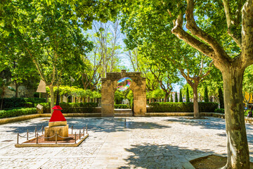 Entrance to Almudaina Palace gardens with water fountain in background, Palma, Mallorca, Baleares,...