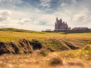 Rough stone coast line and amazing Castle Classiebawn, Mullaghmore area, county Sligo, Ireland....