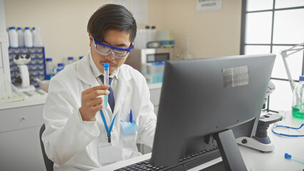 A young asian man analyzing a test tube in a modern laboratory setting, embodying professionalism...