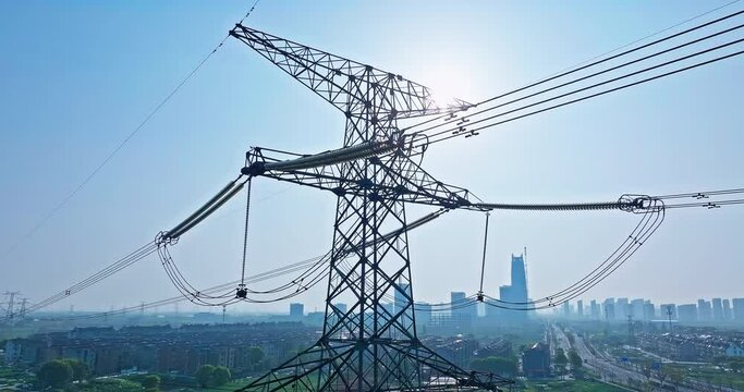 Aerial view of high voltage electricity towers on a sunny day