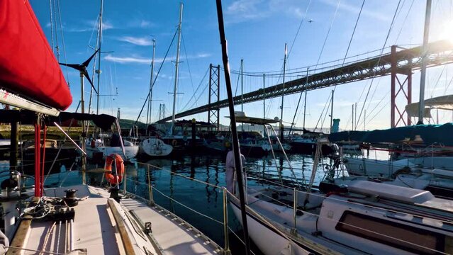 Boats and sailboats in harbor in Lisbon Portugal