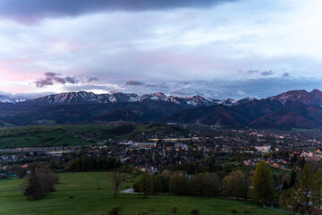 Fototapeta premium A town in the Zakopane Mountains before dawn. Poland. City lights. 