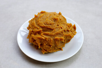 Japanese miso paste on white background.
