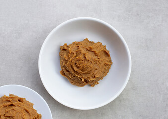 Japanese miso paste on white background.