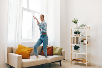 Jumping for Joy: A Carefree Woman Dancing in a Playful Home