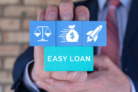Business man holding styrofoam blocks with icons sees inscription: EASY LOAN. Concept of quick and easy loan, fast money providence, business and finance services. Timely payment. Easy instant credit.