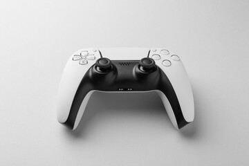 Wireless game controller on light grey background