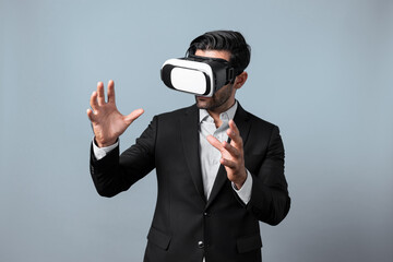 Smart business man with suit holding something while VR goggle to connect metaverse. Professional...