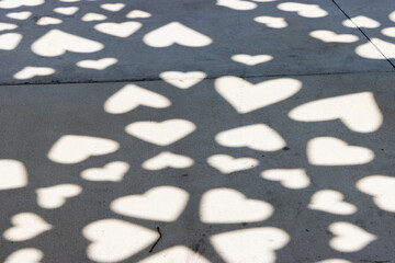 Heart shadows on sidewalk