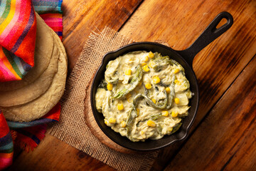 Rajas con Crema. Very popular dish in Mexico that consists of strips of poblano chili with cream,...