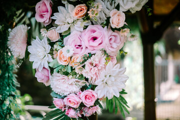 A cluster of assorted flowers delicately intertwined, forming a captivating bouquet that epitomizes...