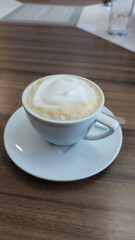 cup of coffee on wooden table