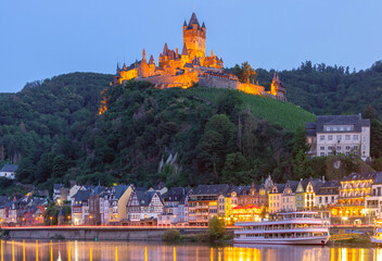 Cochem at sunset, beautiful town on romantic Moselle river, Reichsburg castle on hill, Germany