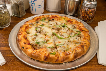 Supreme pizza with green peppers and sausage