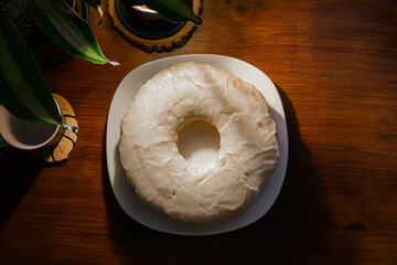 vanilla cake on a plate and sugar glass