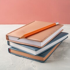 Stack of notebooks with a pencil, stationery and education concept