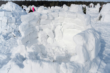 Unfinished shelter from the cold at the competition for the construction of an igloo, the national structure of the Northern peoples