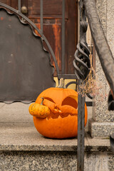 Halloween decorated outdoor cafe or restaurant terrace in America or Europe with carved pumpkins...