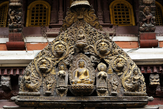 Lalitpur (Patan), Nepal &ndash; April 26, 2023: Tympanum above the Entrance to Golden Temple (Hiranya Varna Mahavihar or Kwa Bahal)
