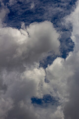 big white and dark clouds in a blue sky