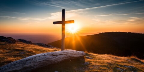 Dramatic sunset landscape with a cross on a hill