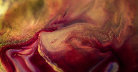 Paint flow. Glitter ink spill. Defocused red pink purple golden color mix shimmering dust sequin...
