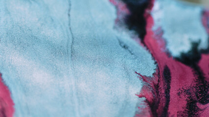 Ink spill. Glitter fluid mix. Defocused blue pink black color metallic shimmering wet paint flow...