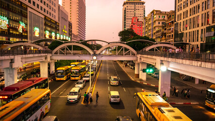 Streets of downtown Yangon Myanmar road to Sule Gold Pagoda sunset with traffic jam and modern city...