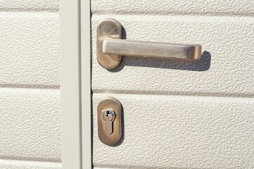 View of the handle and lock of the rolling door