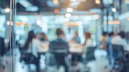 Blurred offices with people working behind glass walls