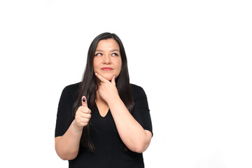 Latin adult woman shows her thumb inked with indelible electoral ink after exercising her right to...