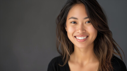 young asian woman posing in studio shot 