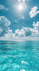 Azure cloudy sky with bright summer tropical sun and turquoise sea or ocean Skyblue tropical paradise