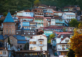 multilayered and vibrant residential areas of Tbilisi, featuring diverse architectural styles from...
