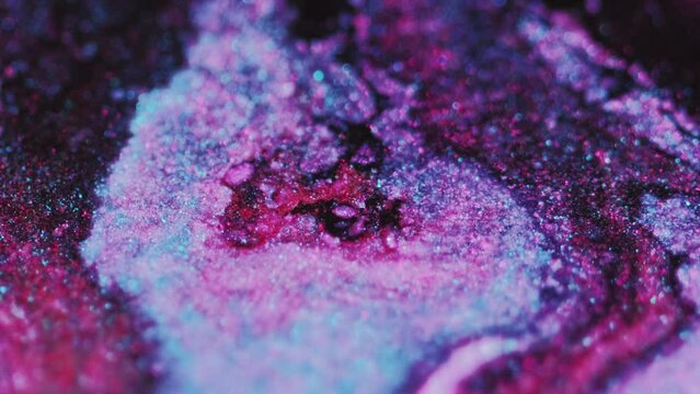 Blur glitter flow. Bokeh light texture. Defocused pink blue purple black color shimmering paint emulsion wave glamour abstract art background.