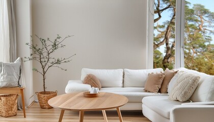 Round wood coffee table against white sofa. Scandinavian home interior design of modern livi