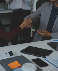 Business people shaking hands after meeting. colleagues handshaking after conference. Greeting...