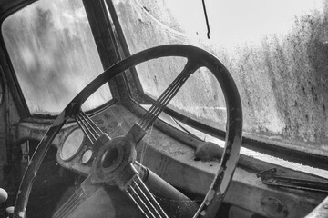 An old truck rusts away in the Australian Outback, engulfed by the bush, a silent relic of time's...