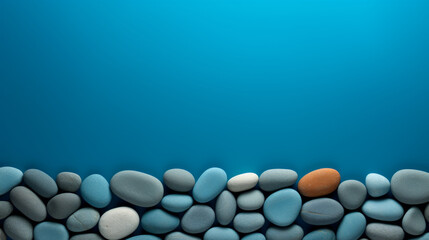 A blue background with a row of rocks on it