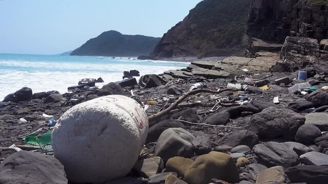 marine garbage debris driftwood Styrofoam Polystyrene foam. Plastic box on deserted shore magnificent coastline stretches behind, Environmental pollution issues.