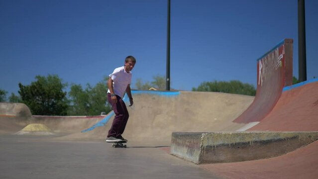 Skateboarder does a trick on the ledge