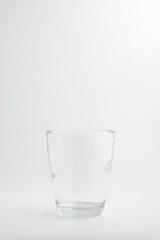 Glass with ice on white background
