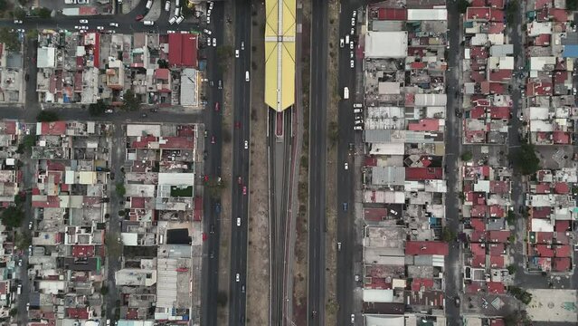 Bird eye view from drone of Avenida Central, metro and neighborhoods in Ecatepec, CDMX, Mexico