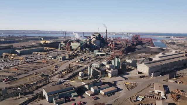 Hamilton's industrial sector with steel factories and smokestacks, aerial view