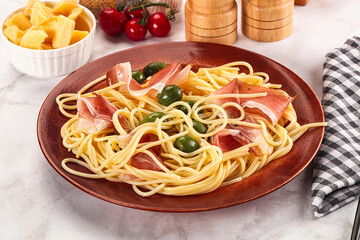 Pasta spaghetti with olives and jamon